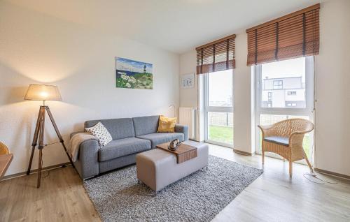 a living room with a couch and a table at Sunset in Olpenitzdorf