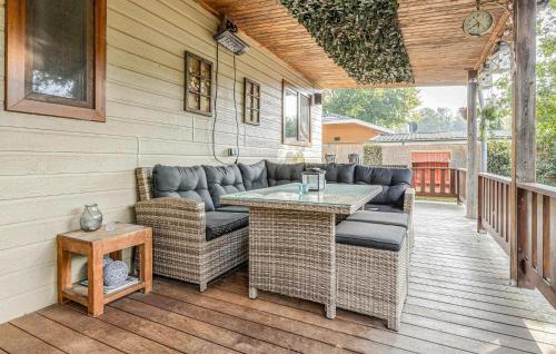 a patio with a couch and a table on a deck at Beautiful Home In Erm With Wifi in Erm