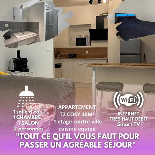 a room with a couch and a kitchen with a sign at logis des abeilles sejour-tricastin in Pierrelatte