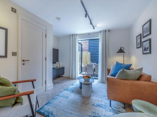 a living room with a couch and a table at Sea Beet - Uk49245 in Whitstable
