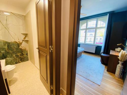 Koupelna v ubytování Amaroo - Apartments "Regia"