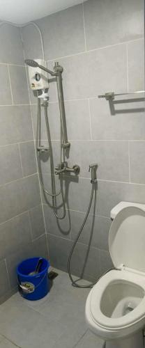 a shower in a bathroom with a toilet at Lei's Abode in Mandaue City