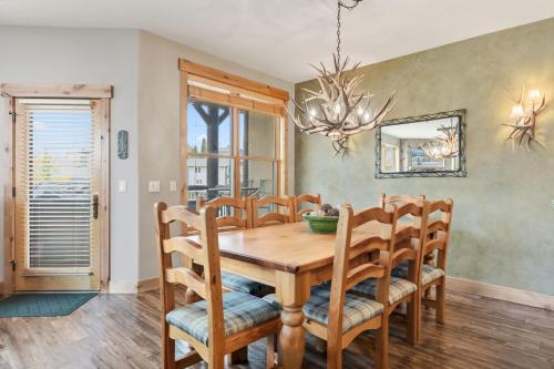 a dining room with a wooden table and chairs at Walk to Main Street Hot Tub Gym and Game Room in Breckenridge