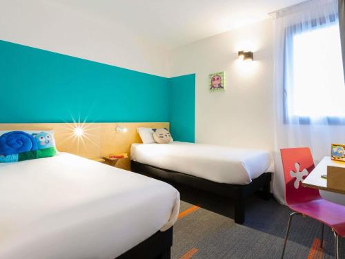 Postel nebo postele na pokoji v ubytování greet Hotel Nancy Sud