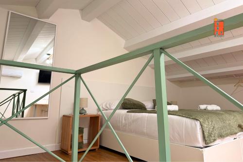 Een bed of bedden in een kamer bij La Casetta nel Borgo