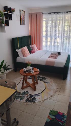 Postel nebo postele na pokoji v ubytování Budget bliss4 bnb Ruaka