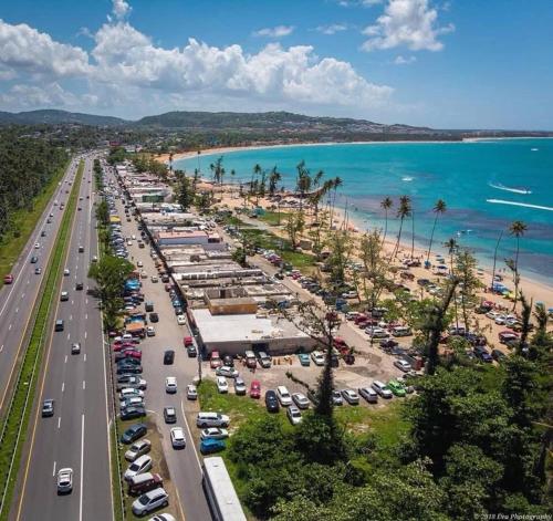 an aerial view of a parking lot next to the beach at Casa Fortuna Near Luquillo Beach & El Yunque in Luquillo