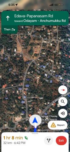 a cell phone screen with a map of a city at New royal home stay in Varkala