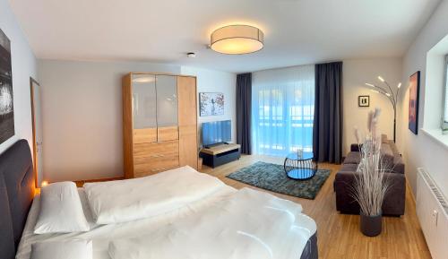 Ένα ή περισσότερα κρεβάτια σε δωμάτιο στο Alp-Partment