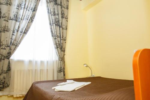 Ένα ή περισσότερα κρεβάτια σε δωμάτιο στο Mini Hotel Venezia