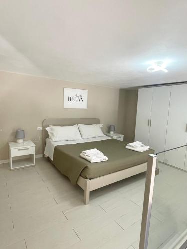 a bedroom with a bed and a sign that reads matrix at Élite Lampedusa in Lampedusa