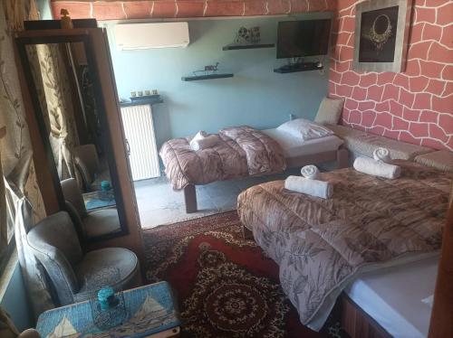 TV a/nebo společenská místnost v ubytování The cave of Cyclops