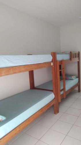 Posteľ alebo postele v izbe v ubytovaní Pousada & hostel Guedes