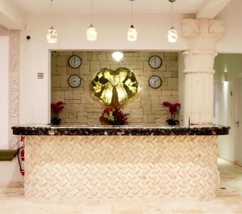 a lobby with a counter with a heart on the wall at Cielo Maya Beach Tulum in Tulum