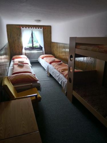 Postel nebo postele na pokoji v ubytování Penzion Liberta