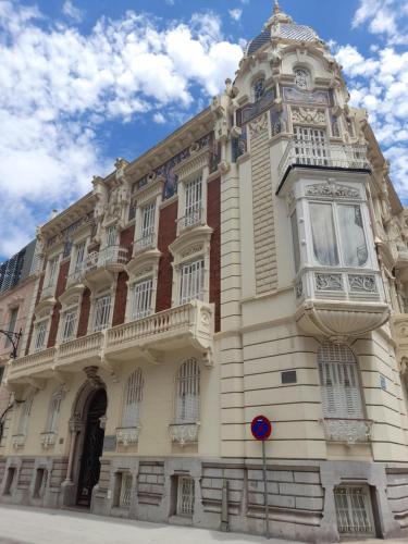 a large building with a balcony on the side of it at Apartamento El Lago Dos, Cartagena Centro in Cartagena