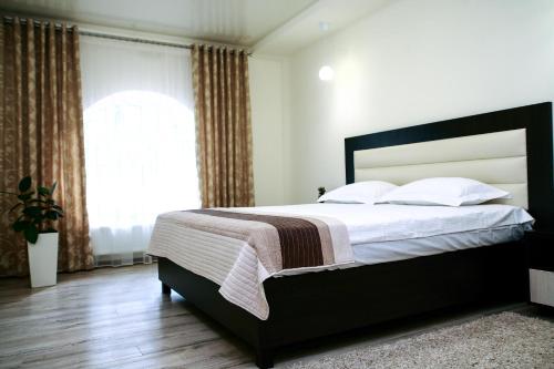 Кровать или кровати в номере Family House