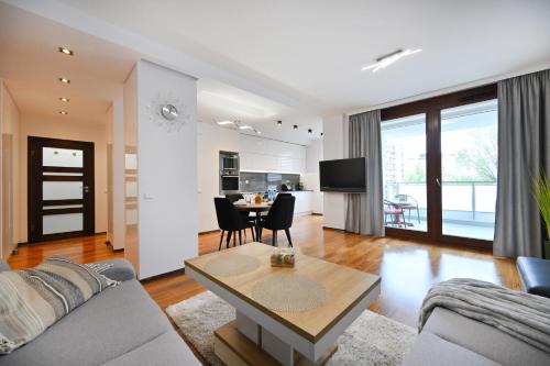 MERIDIAN Building Modern 1BR with Balcony & Parking in Wola