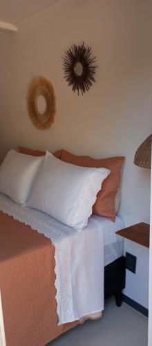 a bedroom with a bed and a mirror on the wall at El refugio in La Paloma