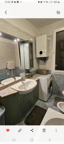 a bathroom with a sink and a washing machine at La dimora di Gabi in Venice