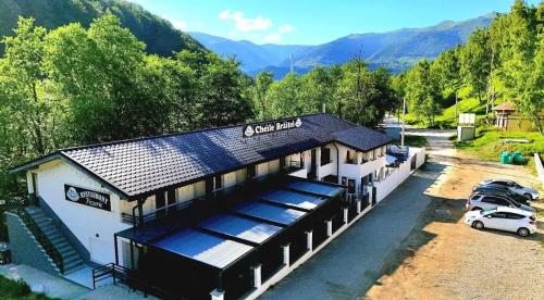 an aerial view of a building with a parking lot at Cheile Braitei in Lupeni