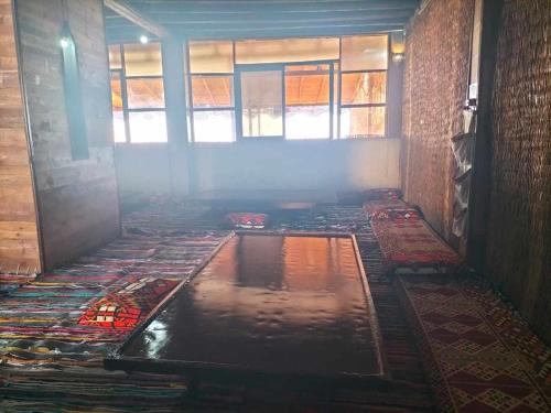 a room with a pool of water on the floor at كامب واحة الغروب in Dār as Salām