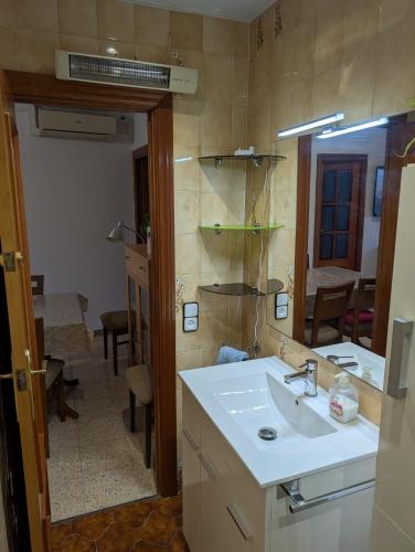 a bathroom with a sink and a mirror at Apartment near Fira Barcelona, Camp Nou, and the center of Barcelona in Hospitalet de Llobregat