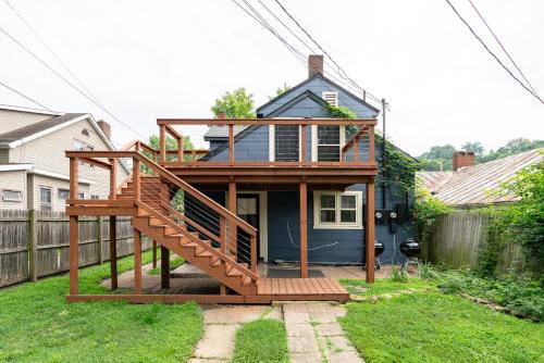 a house with a deck in a yard at Prime Location Top Rated Clean Parking Free! in Chillicothe