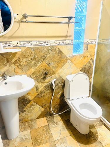 a bathroom with a toilet and a sink at Searide hotel in Ao Phutsa