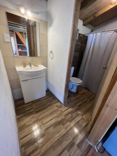 a bathroom with a sink and a toilet at Santo Descanso in Punta Del Diablo