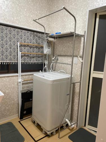 a bathroom with a white sink in a room at 森のプチ別荘チチブンブン in Chichibu