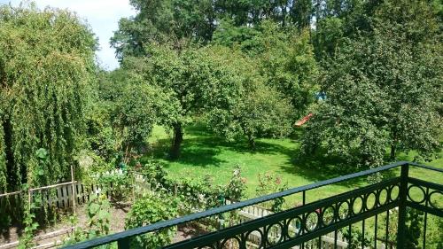 a view of a garden with trees and a fence at Appartementhof Stadler in Pocking