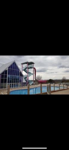 a building with a roller coaster in front of it at Luxury 3 bed swift home in Hastings
