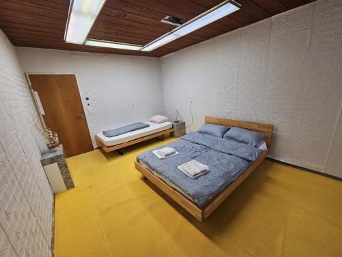 a bedroom with a large bed in a room at Privatzimmer -Venus- mit gemeinsamer Küche und Bad in der Altstadt Chur in Chur