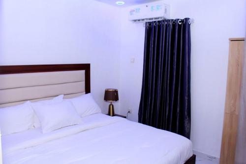 Ένα ή περισσότερα κρεβάτια σε δωμάτιο στο Olu