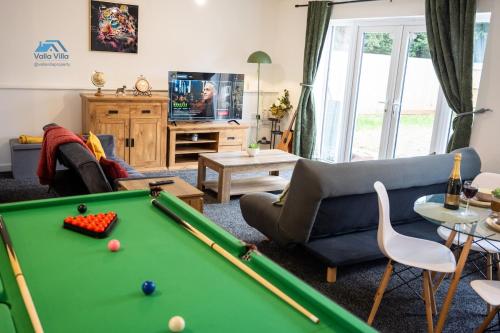 a living room with a pool table and a couch at Pines Villas 1, Three Spacious 3BR Homes, Perfect for Groups in Boughton