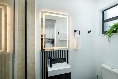 a bathroom with a sink and a mirror at Tropical 2BR2BA Getaway in Gorgeous Key Largo, Marina, Saltwater Lagoon, Pool in Key Largo