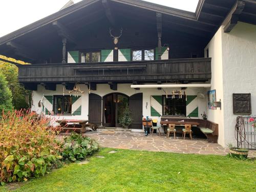 a house with a porch and a patio at Flow In in Kitzbühel
