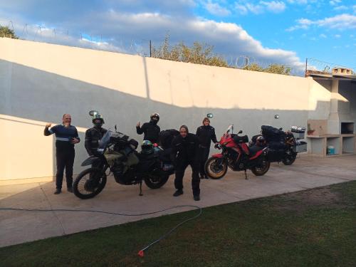 a group of men standing next to their motorcycles at Alojamiento Temporario Sol de las Yungas in Libertador General San Martín