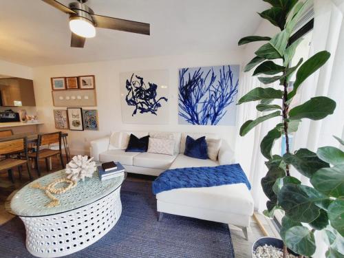 a living room with a white couch and a table at Saltwater Lagoon Front View, Marina, Kayaks in Key Largo