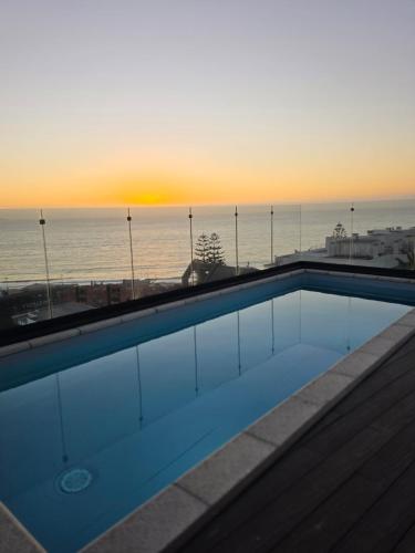 a swimming pool with a view of the ocean at Arka Hotel in Viña del Mar