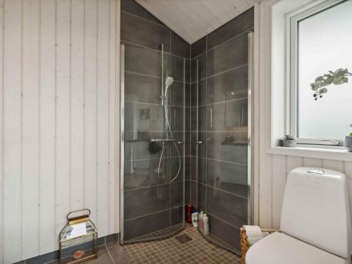 a bathroom with a shower with a glass door at 5 star holiday home in Strøby in Strøby Ladeplads