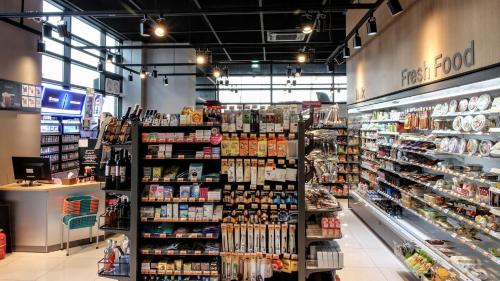 a grocery store aisle with a lot of products at Golden Tulip Ever Yongin Hotel in Tugyeul