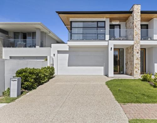 a large white house with a driveway at Swainson on 3 Lexington - 200m to Beach! in Henley Beach
