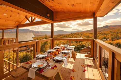 a dining table on a balcony with a view at Big Bear Shack - Handicap Accessible & Dog Friendly in Gatlinburg