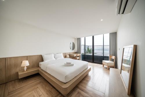 En eller flere senge i et værelse på Bach Plateaus Hotel