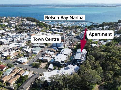 an aerial view of a suburb with a town centre and the ocean at Resort Pool and Garden Apartment, Nelson Bay in Nelson Bay