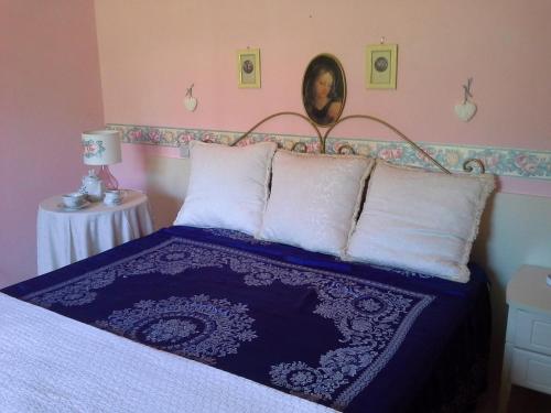 Ein Bett oder Betten in einem Zimmer der Unterkunft Agriturismo La Magione Del Capitano