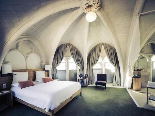 Ένα ή περισσότερα κρεβάτια σε δωμάτιο στο Mercure Poitiers Centre