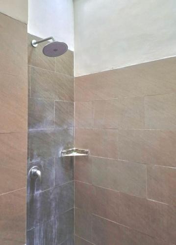 a shower with a glass door in a bathroom at Luka's Place - 1 bedroom in Cemagi